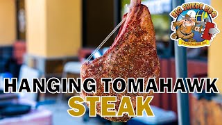 How to grill a HANGING Tomahawk Steak over open fire  Burch Barrel Grill [upl. by Issy]