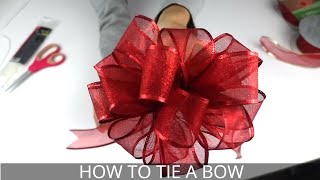 How to Make a Christmas Bow  Easiest BowMaking Method [upl. by Airebma]