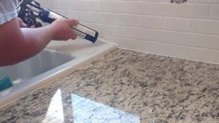 How to install silicone caulk around kitchen countertop shower bath tub etc [upl. by Petulah553]