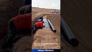 Plastic sheeting being laid down desert  The workers do their job perfectly  machine shorts [upl. by Det]