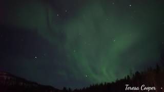 The Aurora Borealis pulsates amp dances over a frozen lake Levi Finland [upl. by Hcahsem]