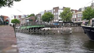 Haarlem Netherlands The swing swing bridge over the canal opens The ships begin to move Spaarne [upl. by Eitac334]