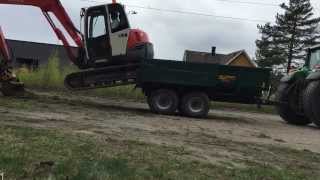 Kubota KX 0803 excavator climbing on to a Palmse trailer The tractor is John Deere 6920 [upl. by Janelle]