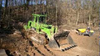 Caterpillar 963D and 973 track loaders with Terex TA 6s site dumper [upl. by Hazem210]