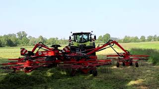 Claas Axion 870 mit Kuhn 13131 beim Gras schwaden [upl. by Sauder554]