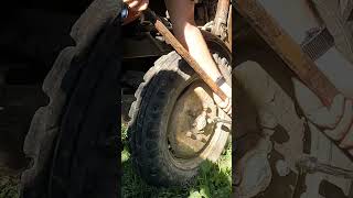 Taking off tractor tyre  Crafty Lab Homestead 60 year old tractor [upl. by Ainoyek]