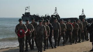 British Marine commandos land on Gold beach for DDay commemorations  AFP [upl. by Lewin]