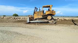 Caterpillar D6R Mustard bulldozer builds a new road on the beach [upl. by Horter586]