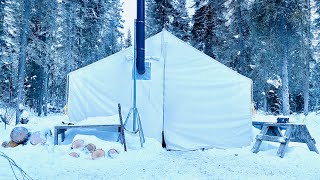 Winter camping overnight in a canvas tent with a wood stove [upl. by Dorian]