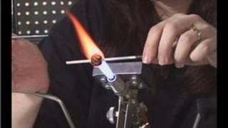 How to Make Glass Beads  Melting Glass Dots on a Glass Bead [upl. by Nrek]