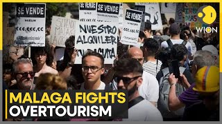 Hundreds of Malaga residents march against mass tourism  Latest English News  WION [upl. by Enorej951]