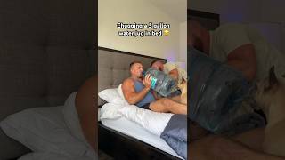 Chugging a 5 gallon water jug in bed to get my fiancés reaction 😂😂 [upl. by Ardnaik]