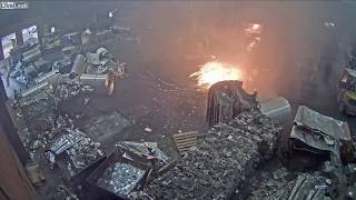 Foundry worker puts wet scrap metal in furnace [upl. by Danit259]