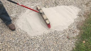 brushing CHEAP concrete onto a gravel driveway adding strength and resilience [upl. by Notlehs339]