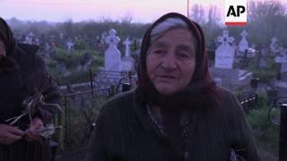 Romanias Orthodox Christians honour the dead [upl. by Ocsic]