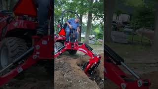 Massey Ferguson compact tractor backhoe digging [upl. by Eednam]