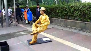 StatueMan Sit Down Without Chair NO MAGIC TRICK [upl. by Dinesh104]