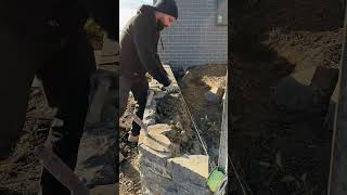 Completing a Blue Stone retaining wall canberra stonemason masonry landscaping [upl. by Aicul874]