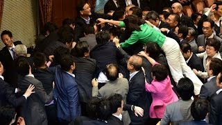 Brawl in Japanese parliament over controversial security bill [upl. by Aikkan]