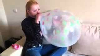 Sue inflate a transparent balloon and make a sit to pop [upl. by Darla]