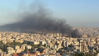 Huge plumes of smoke billow above Beiruts skyline following overnight Israeli strikes [upl. by Illib]