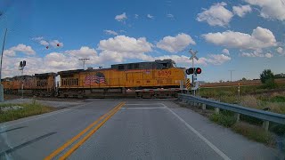 3 UP Locomotives with 58 freight cars going through railroad crossing on the Spine Line [upl. by Hsima825]