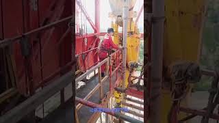 Derrick worker working on a twostory platform over 30 meters above the ground oilfield oilwell [upl. by Maro]