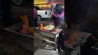 Mexican street food in Oaxaca Tlayudas cooking over open flame on the street mexico streetfood [upl. by Arukas]