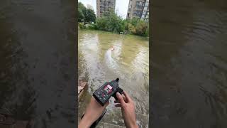 Playing remote control speedboat in the rainy water in the community [upl. by Anirroc]