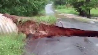 ROAD EROSION BY FLOODING CAUGHT ON CAM [upl. by Ennoved807]