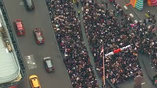 Crowds gather in Times Square for surprise from BTS member Jung Kook [upl. by Barbie306]