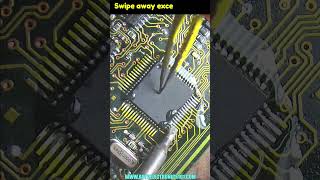 Drag soldering technique for 64 leg smd chip soldering electronicsrepair short [upl. by Sivartal]