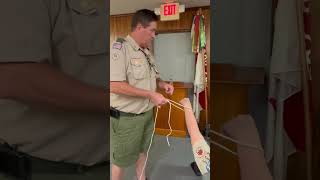 Mr Martin the Assistant Scoutmaster teaches scouts how to tie a timber hitch [upl. by Howlan697]