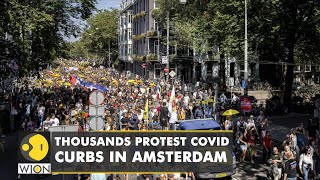 Netherlands Thousands protest against Covid19 curbs in Amsterdam  Latest English News  WION [upl. by Irret828]