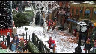 Christmas Village Displays  with Lemax houses Department 56 models trees snowmen and figurines [upl. by Farleigh]