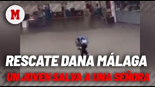 Rescate viral de un joven a una señora bloqueada por la riada en Málaga durante la DANA [upl. by Cookie894]