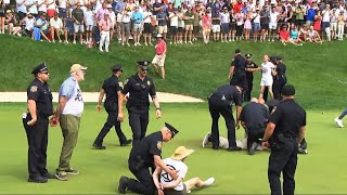 Protesters at Travelers Championship tackled by police after running onto 18th green [upl. by Atrebor950]