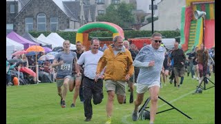 Dufftown Highland Games Overseas Race For Men in SlowMotion [upl. by Olnton718]