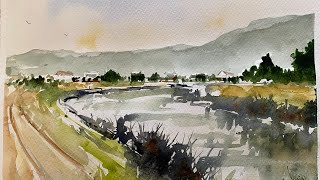 Watercolour demo  Watercourse or river into distant town [upl. by Eixam555]