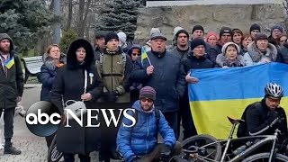 Demonstrators sing Ukrainian anthem in Melitopol [upl. by Thorpe]