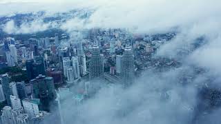 Petronas Twin Towers covered with clouds [upl. by Nirroc]