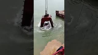 Grab dredger is performing dredging work [upl. by Eimmaj]