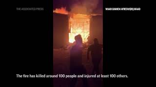 Cellphone video captures deadly fire at Iraqi wedding hall [upl. by Swehttam189]