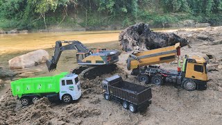 Machines and trucks operating to carry sand to fill streams [upl. by Delphine]