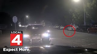 Dashcam video show lit firework tossed at police cruiser in Dearborn [upl. by Ritter]