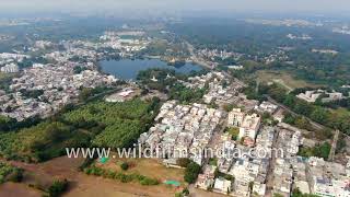 Neatly laid out city of Vadodara in aerial view Baroda in Gujarat has lakes and greenery [upl. by Keryt]