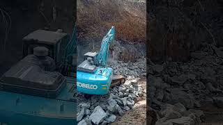 Excavator working in rock breaking [upl. by Dixil]