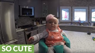 Baby enjoys ride atop robot vacuum cleaner [upl. by Ecneralc]