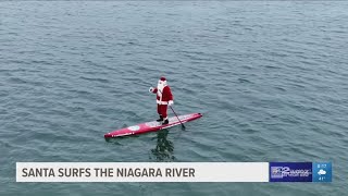 Surfin Santa enjoys 5kilometer paddle along the Niagara River [upl. by Hcra82]